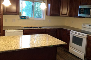 Giallo Ornamental Granite & Rushmore Cabinets
